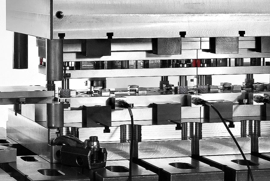 Close-up of an industrial press machine with metallic component